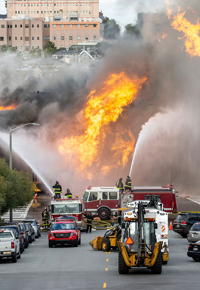 Firefighters fighting gas line explosion