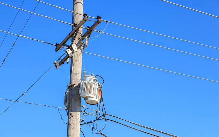 Telephone pole with power lines