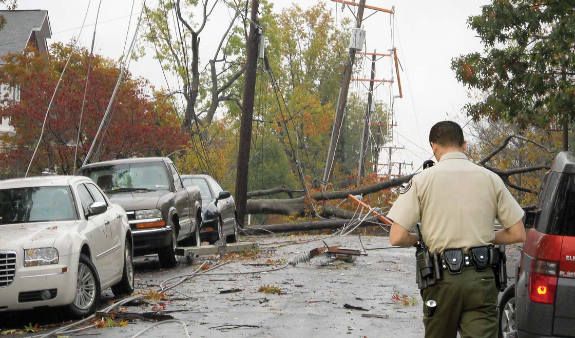 Police officer near downed power lines