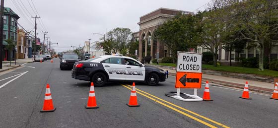 Police car barricade in front of roadwork